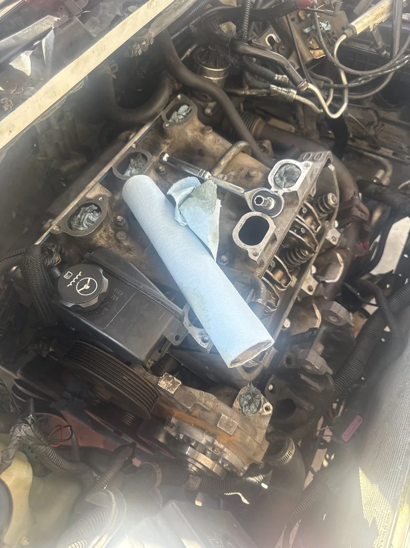 An engine opened up mid repair, heads coming off.