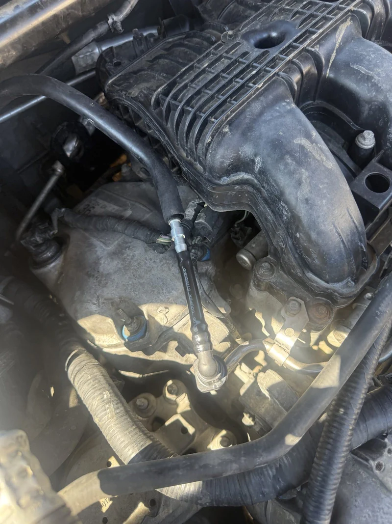 An intake manifold in place before it comes off.