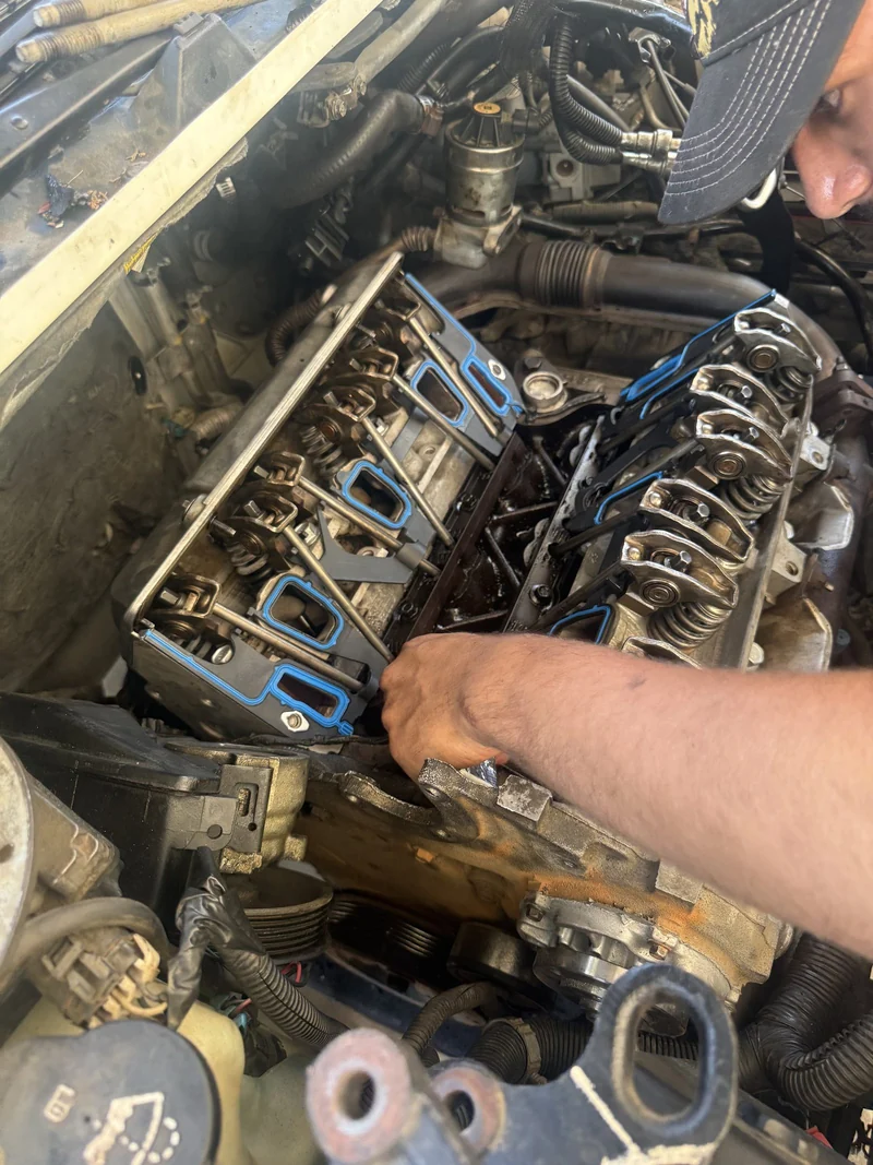 Working the valvetrain during an overheat repair.