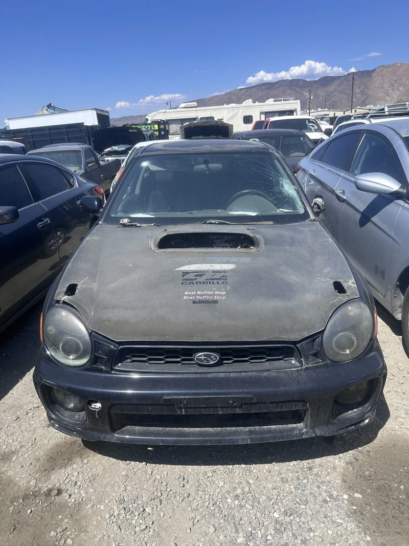 A Subaru waiting its turn in the yard.